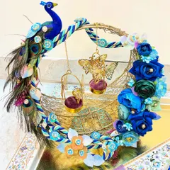 A ring platter should be as special as the moment itself. We designed this custom peacock-themed ring platter with vibrant blue florals and intricate feather details to create a royal stage for the rings. It’s a piece that truly celebrates the promise of a lifetime together.