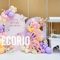 To complement the main backdrop, I can provide themed props like this white candy cart. It adds another focal point to the party and is perfect for displaying cakes, desserts, or party favors.