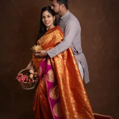 A sweet kiss on the forehead during their saree maternity session. The vibrant colors of her saree bring so much warmth and joy to this portrait.