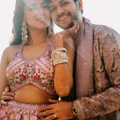 Rupanshi and Yash in a sun-drenched, happy portrait. The lens flare adds a touch of magic to this candid moment of affection.