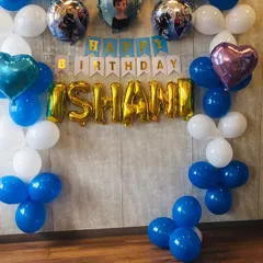 Let it go and celebrate. This Frozen-themed birthday party for Ishani was a winter wonderland, with blue and white balloons, character foil balloons of Elsa and Anna, and a festive "Happy Birthday" banner.