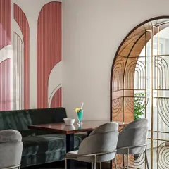 Details give a space its unique emotion, or 'olavu'. For the 'Pink Verranda' restaurant, I used art deco inspired arches in shades of pink to create a signature look. This is complemented by a custom metal-frame arch, blending modern art with heritage charm.