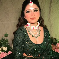 A close-up of my 'Mehendi Vibes' look. The makeup features a beautiful green smokey eye, flawless skin, and is paired with custom floral and diamond jewelry.