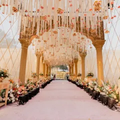 Your journey together should begin with a path of beauty. I crafted this immersive floral archway, dense with blooms and hanging tassels, to create a magical transition for the couple and their guests into the heart of the celebration.
