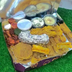 Here's a look inside our Iftar Box before it's sealed. You can see the variety of starters, the different chutneys and sauces in their containers, and how everything is packed neatly to stay fresh.