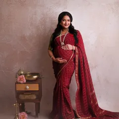 There is a special kind of magic in a traditional maternity shoot. This gorgeous mother-to-be in a rich red pattu saree is the perfect example of grace and cultural elegance. I love capturing the richness of our heritage in these precious moments.