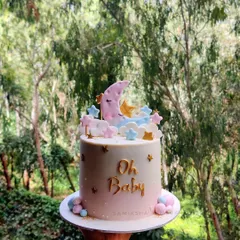 A closer look at my "Oh Baby" moon and stars cake. The soft colors and sweet details make it a perfect centerpiece for celebrating a baby on the way.