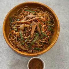 Our Naga-style noodles are packed with flavor and spice. This hearty bowl is tossed with fresh vegetables and shredded meat, served with a side of our house-made chili paste.