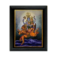 This canvas painting of Vishnu and Lakshmi riding on Garuda is beautifully enhanced with Tanjore-style gold work. The fusion of techniques creates a dynamic and divine artwork, perfect for any spiritual space.