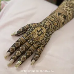 A bold and beautiful design for the back of the hand, featuring the couple's initials 'JJ' inside a detailed mandala.