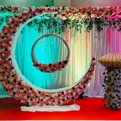 For a naming ceremony, I create magical setups like this one. The centerpiece is a large floral crescent moon holding a decorated baby palna, or cradle. This design makes the baby the star of the show and provides a beautiful backdrop for photos.