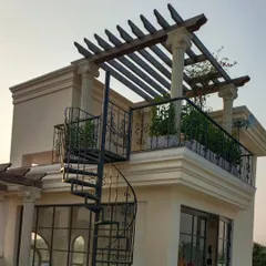 This project showcases a classical Victorian theme on a modern terrace. We incorporated architectural columns, a wooden pergola, and a spiral staircase to create a timeless and elegant outdoor space.