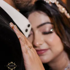 Focusing on the gentle touch and serene emotion. This natural engagement portrait highlights the bride's intricate jewelry and the couple's closeness.