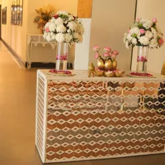 The welcome console table positioned in the hallway, greeting guests as they arrive. The elegant floral decor and mosaic design of the table set a sophisticated tone for the event.