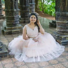 A beautiful portrait from a collaborative photoshoot. The model is wearing one of my peach-pink tulle lehengas, a soft and romantic piece.