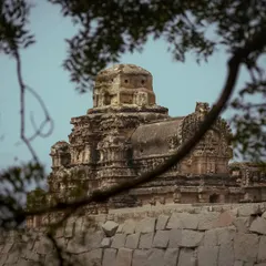 A temple in Hampi framed by tree branches. Using natural frames like this adds depth and a sense of discovery to my architectural photography.