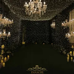 Inside the fairy light tunnel, we placed elegant crystal chandeliers to add a touch of classic glamour to the magical, starry ambiance.