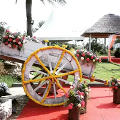 We love incorporating rustic and creative props into our decor. This decorated bullock cart, adorned with marigolds and mixed floral bouquets, serves as a unique and charming photo booth or entrance piece for a Mehendi or Haldi event.