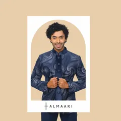 This textured blue bandhgala jacket is a versatile piece that works for both weddings and formal parties. It has a modern pattern that adds interest while remaining classic.
