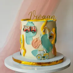 An abstract construction-themed cake. I used painted buttercream patches and small fondant vehicles to create a modern and artistic take on the theme.