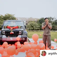 The pure shock and joy of a perfectly executed surprise. We filled the area around the car with balloons to make the reveal even more festive and photogenic.