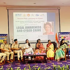 On stage for a panel discussion on Legal Awareness and Cyber Crime at SGT University. Educating students is crucial for building a safer society for women.