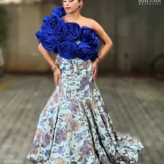 A full-length view of this stunning glam look. The dewy skin and bold blue floral top create a moment that is both trendy and timeless.