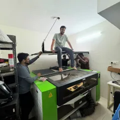Setting up the heavy machinery in our new makerspace. This laser cutter is the heart of our operation, allowing us to design and prototype all of our wooden robot kits in-house.