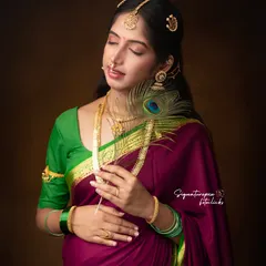 This close-up highlights the delicate traditional jewelry and peaceful expression in our Ravi Varma inspired series.