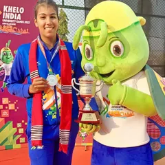 Kashish Bhatia proudly displays her silver medal and runner-up trophy at the Khelo India University Games in Guwahati.