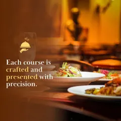 Each course at our buffet is crafted and presented with precision. This image shows a guest being served from a well-organized and beautifully arranged food station.