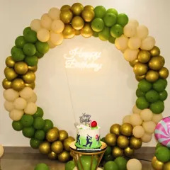 My cricket-themed cake set against a beautiful balloon backdrop, ready for a 10th birthday celebration.