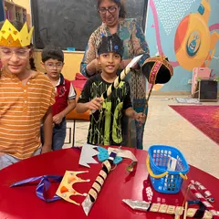 Getting all the props ready for the big show. This little one is checking out the handmade bows and arrows for our Dussehra Ramleela play. It’s a hands-on history lesson.