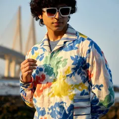 Awaken an aura of understated elegance. This vibrant floral printed shirt, shown here with the sea link in the background, is a testament to luxury where form meets function.