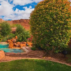 Can you spot the speaker? Our outdoor audio solutions are designed to blend into your landscape. This satellite speaker is tucked away among the foliage, providing rich sound for the pool and garden area without disturbing the natural beauty.