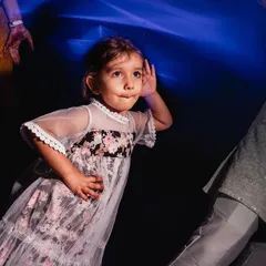 Children bring their own magic to every celebration. This candid shot captures the pure, uninhibited joy of a young guest on the dance floor during a family event. My goal is always to find these authentic, fleeting moments that tell a bigger story.
