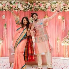 Pure celebration. This shot captures the couple's excitement and energy on their engagement day, with arms raised in joy.