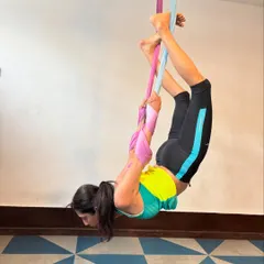 With consistent practice, you'll discover new levels of flexibility and strength. This deep stretch uses the aerial silk to help open the hips and lengthen the spine in a way that's difficult to achieve on the mat.