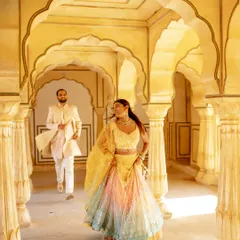 Your pre-wedding shoot is a story of your love, and your outfits should be just as epic. Here's how I help couples coordinate their looks, with a royal sherwani for him and a dreamy lehenga for her.