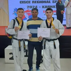 Two of my black belt students after winning gold medals at the CISCE Regional Sports event. Their hard work and discipline paid off on the winners' podium.