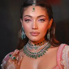 Fresh and dewy with a pop of color. This look for a Mehendi ceremony features a bright pink inner corner liner, adding a fun and modern twist.