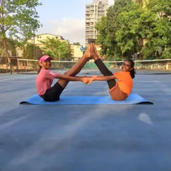 Flexibility and teamwork are just as important as strength. Our players practice partner yoga to improve balance and prevent injuries, fostering a supportive team environment.