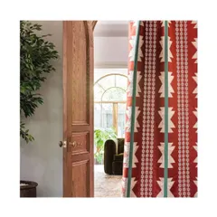 A single fabric can define a room. This Chimayo fabric, with its bold stripes and intricate couched embroidery, offers a modern twist on traditional design. I use such statement textiles for drapes or upholstery to add a vibrant pop of colour and personality.