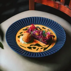 Our baked beetroot and carrot pavé, a colorful and inventive vegetarian dish where flavors combine in a medley of familiar comfort and inspiration.