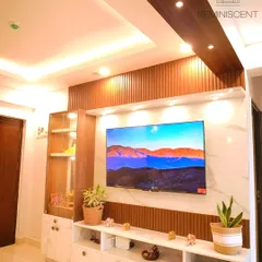 This entertainment unit is a perfect example of modern luxury, featuring a marble-finish back panel with wood fluting and integrated display shelves. The floating console provides ample storage while maintaining a clean, sophisticated aesthetic.