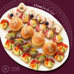A feast for the eyes, this platter showcases a variety of our bite-sized creations. From mini burgers to savory tarts, each appetizer is crafted to offer a burst of flavor and visual appeal.