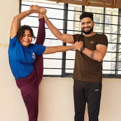 A joyful moment of achievement. I'm here to support my students as they reach new heights in their practice, like this beautiful standing split.