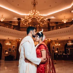 A quiet moment of togetherness in a grand, beautifully lit hall. We excel at using dramatic lighting and stunning venues to create timeless, cinematic portraits that feel like a scene from a movie.
