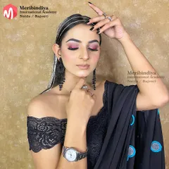 A chic and edgy party look, with hair styled straight and accessorized with a rhinestone headband and long, dangling hair chains.