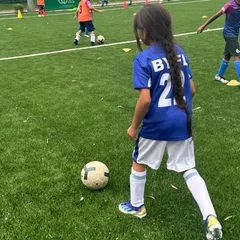 We believe in nurturing passion from the very first touch of the ball. Here, one of our young players is focused and engaged during a drill, showcasing the fun and inclusive environment we create for all kids, including our girls football training program.
